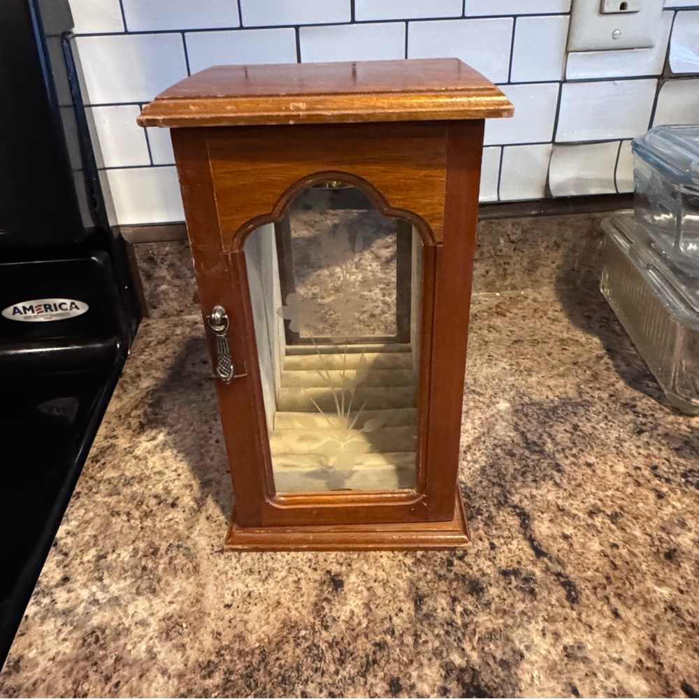 vintage wooden jewelry armoire box glass front necklaces, rings, and earrings